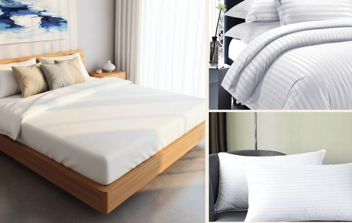 Hotel bed with white bedding, striped duvet cover and pillows